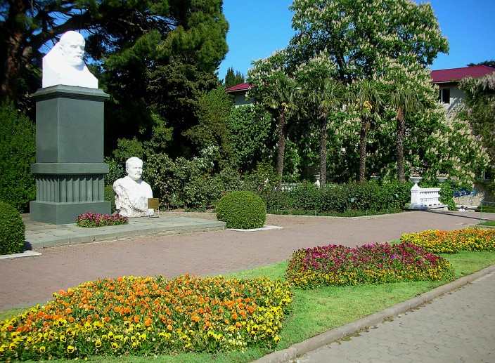 Lenin and some other dude glowering at the flowers